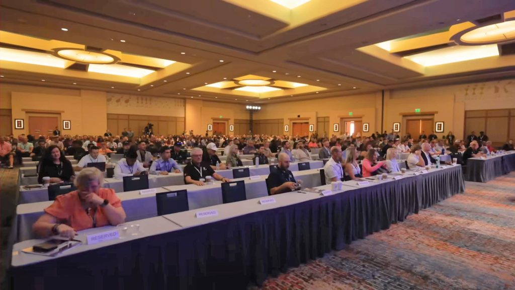 people sitting in 
conference hall